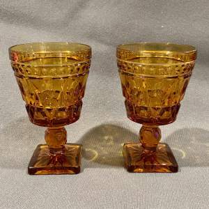 Pair of Victorian Amber Glass Wine Glasses