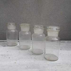 A Set of 4 Vintage Transparent Glass Pharmacy Bottles