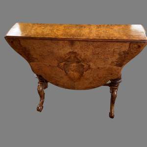 A Victorian Burr Walnut Shaped Oval Sutherland Table