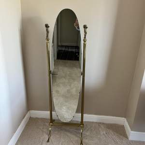 A Mid Century Oval Brass Cheval Mirror