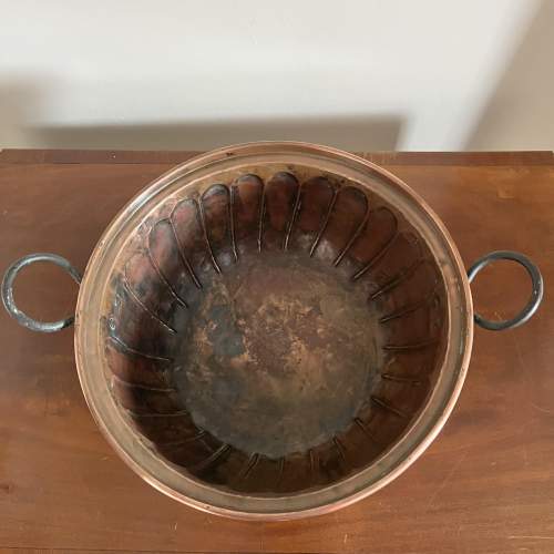 A Large Repousse Copper Bowl with Iron Handles image-3