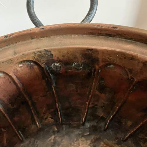 A Large Repousse Copper Bowl with Iron Handles image-6