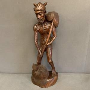 Ironwood Sculpture of a Travelling Man