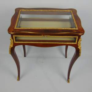 A Fine Rosewood Serpentine Shaped Bijouterie Display Table