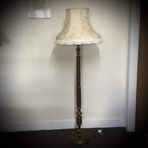 A Walnut Hand Carved Standard Lamp