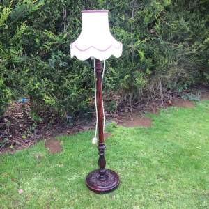 Carved Wooden Standard Lamp with Cream Tasselled Shade
