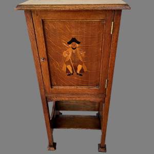 An Arts and Crafts Oak Smokers Cabinet