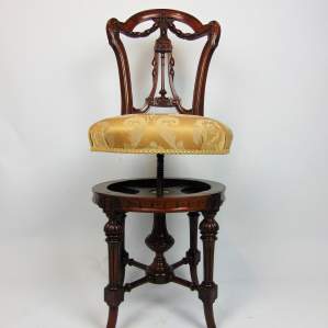 A Superb Walnut Music Chair with a Delicate Carved Back