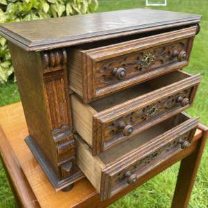 A Miniature Oak Chest of Drawers
