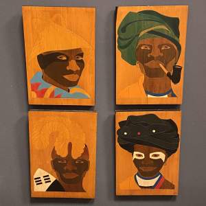 Set of Four Incised Wood Panels Depicting South African Tribesmen