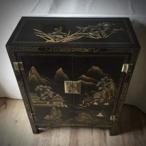 A Lovely Chinoiserie Laquered Marriage Cabinet