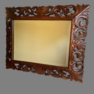 A Victorian Carved Oak Mirror