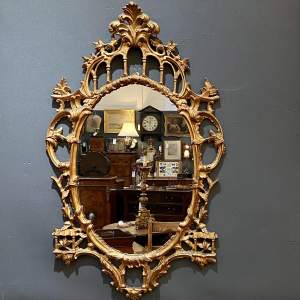 Large Italian Giltwood Oval Mirror in the Chippendale Style