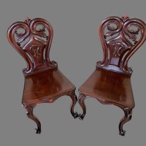 A Pair of Mahogany Hall Chairs
