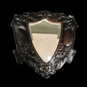 A Unique Arts and Crafts Decorative Shield Shaped Mirror Circa 1910