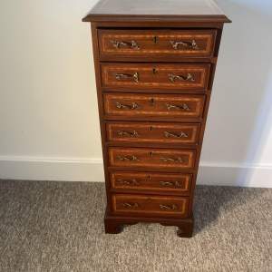 A Small Edwardian Inlaid Seven Drawer Chest
