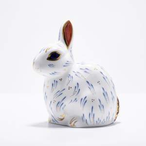 A Royal Crown Derby Ceramic Snowy Rabbit Paperweight