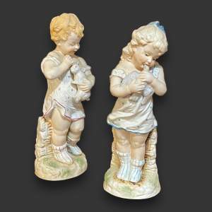 Pair of Bisque Figures of a Boy and Girl