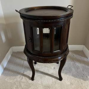 A Coloniale Round Showcase Drinks Cabinet with Tray