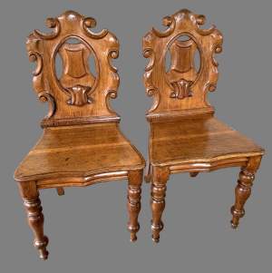 A Pair of Mid Victorian Oak Hall Chairs
