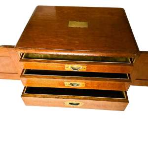 An Edwardian Oak Collectors Cabinet