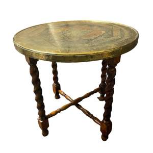 A Middle Eastern Brass Topped Occasional Table