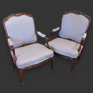 Matched Pair of Early 19th Century French Walnut Armchairs