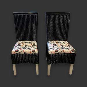 Pair of Black Wicker Chairs with Elvis Cushions