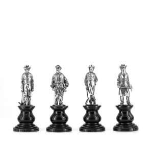 A Rare Group of Four Antique Silver Statuettes of Miners