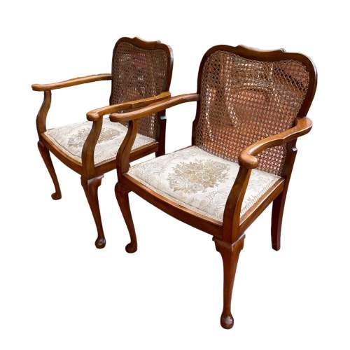 An Attractive Pair Of Early Walnut  Arm Chairs with Caned Backs image-1