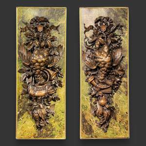 Rare Pair of Carved Black Forest Wall Plaques