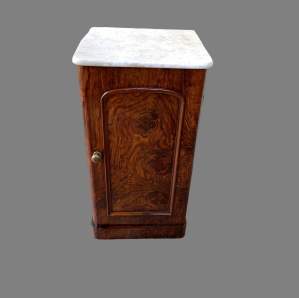 A Victorian Figured Mahogany Pot Cupboard with a Marble Top