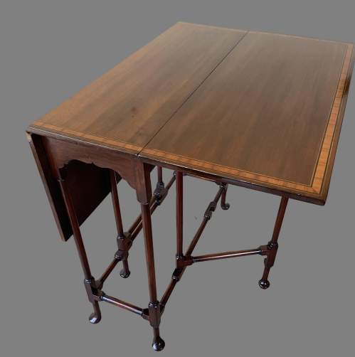 An Edwardian Inlaid Mahogany Sutherland Table. image-3