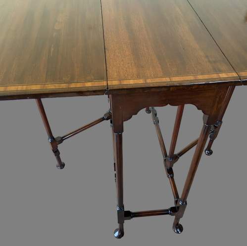 An Edwardian Inlaid Mahogany Sutherland Table. image-4