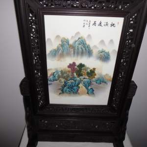 An Oriental Table Screen with Porcelain Plaque