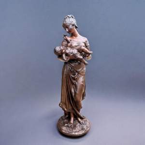 A Finely Cast Bronze Figure depicting a Mother with Cherub